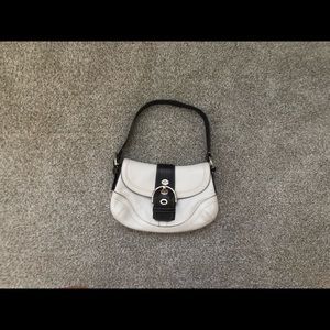 White & dark brown Coach purse.